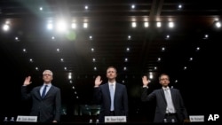 FILE - From left, Facebook's General Counsel Colin Stretch, Twitter's Acting General Counsel Sean Edgett, and Google's Law Enforcement and Information Security Director Richard Salgado, are sworn in for a Senate Committee on the Judiciary, Subcommittee on Crime and Terrorism hearing on Capitol Hill in Washington, Oct. 31, 2017.