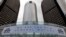 A banner hangs at the front of the General Motors Co world headquarters announcing GM's return to the New York Stock Exchange (NYSE) in Detroit, Michigan, Nov. 18, 2010.  