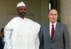 FILE - Then-French François Mitterrand welcomes Hissene Habré at the Elysée palace, in Paris, Oct. 21, 1989.