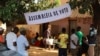 FILE - People line up to cast their ballots in Guinea-Bissau's legislative elections in Bissau, June 4, 2023. 