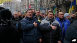 Ukrainians sing the national anthem during a Pro-European Union rally in Independence Square in Kiev, Ukraine. (Dec. 15, 2013) 