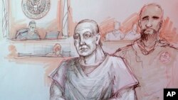 FILE - In this courtroom sketch, Cesar Sayoc, left, appears in federal court in Miami, Oct. 29, 2018. 