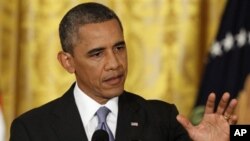 FILE - President Barack Obama during a news conference in the East Room of the White House in Washington, Aug. 9, 2013. 