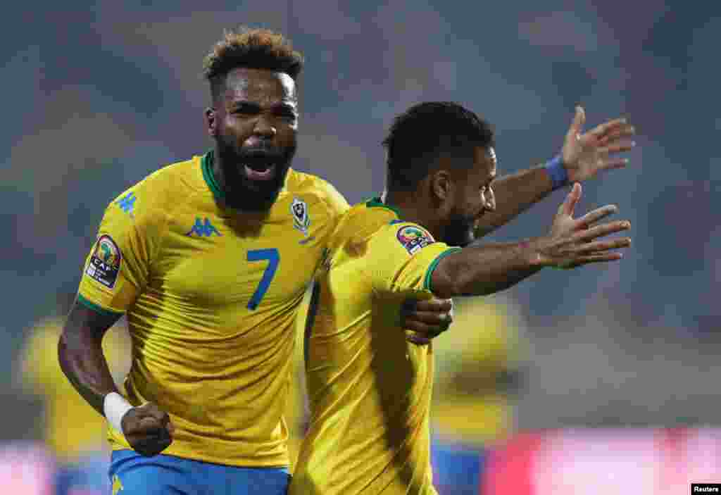 Gabon&#39;s Jim Allevinah celebrates scoring their first goal with Aaron-Salem Boupendza in the game pitting Gabon against Morocco; Cameroon, Jan. 18, 2022.