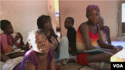 Venise Louis, at far right, was shunned by relatives after being diagnosed with HIV infection. She found refuge at a Haitian orphanage.