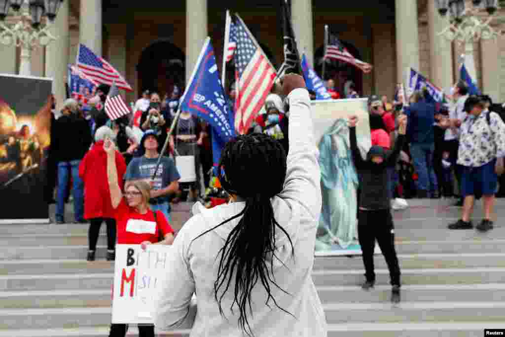 Protesters rally outside the State Capitol building after former Vice President Joe Biden was declared the winner of the 2020 U.S. presidential election, in Lansing, Michigan, Nov. 8, 2020.