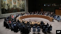 Members of the Security Council vote after presentations for a resolution for an independent investigation on the use of chemical weapons in Syria during a Security Council meeting, April 10, 2018, at United Nations headquarters. 