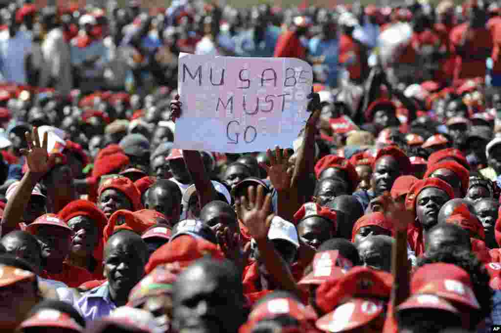 A poster showing opposition to Zimbabwe&#39;s President Robert Mugabe is seen at a final Movement For Democratic Change (MDC) campaign rally in Harare, July 29, 2013. 