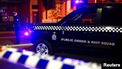 A policeman stands on a street blocked to the public after Australian counter-terrorism police arrested four people in raids across several Sydney suburbs in Australia, July 29, 2017.