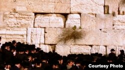 FILE - People pray at the Western Wall, Jerusalem.