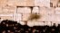 FILE - People pray at the Western Wall, Jerusalem.