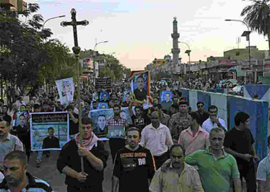 Muslims and Christians chant anti-terrorist slogans during a funeral of slain Christians in Baghdad, Iraq, 02 Nov 2010