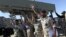 Iranian navy personnel celebrate after successfully launching a Ghader missile from the Jask port area on the shores of the Sea of Oman during a drill, January 1, 2013.