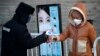China Reports Fewer New Cases of Coronavirus
