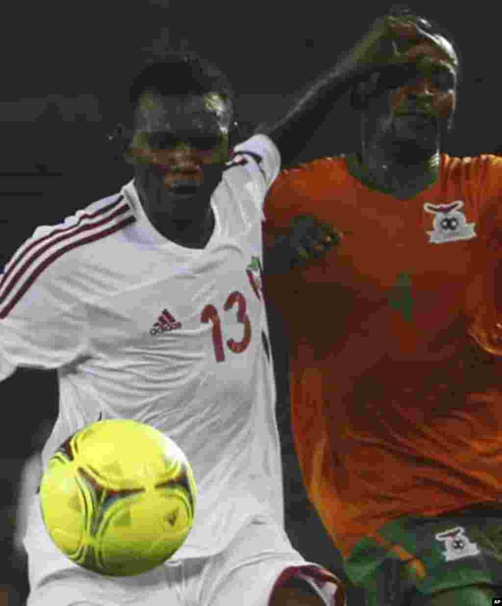 Joseph Musonda of Zambia (R) fights for the ball with Amer Kamal of Sudan during their African Nations Cup quarter-final soccer match at Estadio de Bata "Bata Stadium", in Bata February 4, 2012.