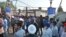 People gather outside after a blast at Nirankari Bhawan, a prayer hall in Adliwal village near Amritsar, India, Nov. 18, 2018.