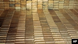 FILE - Gold bars are stored at the U.S. depository in Fort Knox, Ky., Sept. 24, 1974.