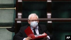 Poland's main ruling party leader Jaroslaw Kaczynski, wears a mask for protection against coronavirus in parliament during work on new legislation in Warsaw, Poland, Tuesday, May 12, 2020.