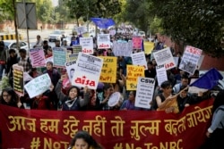 FILE - Indian students and activists participate in a protest rally against a new citizenship law, in New Delhi, Jan. 3, 2020.