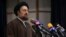 FILE - Hassan Khomeini, grandson of the founder of Iran’s Islamic Republic, Ayatollah Khomeini, speaks in Tehran, Iran, Dec. 18, 2015. Khomeini's bodyguards assaulted a reporter in Tehran, and reporters said such an attack is routine there. 