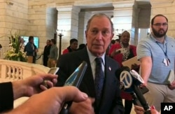 FILE - Former New York City Mayor Michael Bloomberg talks to the media after filing paperwork to appear on the ballot in Arkansas' March 3 presidential primary, Nov. 12, 2019 in Little Rock, Ark.
