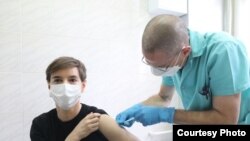 Serbian PM Ana Brnabic gets vaccinated against COVID-19 at the Institute of Virology, Vaccines and Sera – Torlak, in Belgrade, Serbia on December 24, 2020.