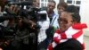 Zimbabwe's Lawyers For Human Rights Board Member Beatrice Mtetwa speaks to the media outside the High Court after she was granted a $500 bail in Harare, March 25, 2013.