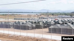 FILE - Tents for detained migrants are seen at the U.S.’s Guantanamo Bay naval station, Cuba, on Feb. 21, 2025. Defense officials told VOA on March 12, 2025, that the last migrants being held there were taken to the mainland to wait for deportation. (U.S. Navy via Reuters)