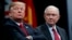 FILE - President Donald Trump sits with Attorney General Jeff Sessions during the FBI National Academy graduation ceremony in Quantico, Va.
