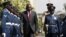 FILE - Kenya's President Uhuru Kenyatta inspects a guard of honor before the annual State of the Nation address at the Parliament Buildings in Nairobi, March 31, 2016. 