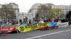 The road is blocked by demonstrators during a climate protest at Marble Arch in London, Tuesday, April 16, 2019. 