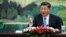 FILE - Chinese President Xi Jinping meets head of the International Olympic Committee's ethics commission and former U.N. Secretary-General Ban Ki-moon at the Great Hall of the People in Beijing, May 15, 2018.