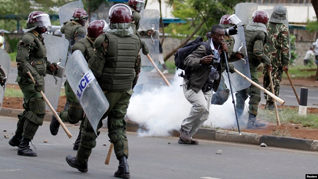 Kenyan police are seen dispersing a rally by university students in Kenya's capital Nairobi, May 20, 2014.