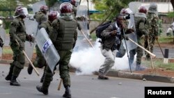 Kenyan police are seen dispersing a rally by university students in Kenya's capital Nairobi, May 20, 2014.