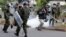 Kenyan police are seen dispersing a rally by university students in Kenya's capital Nairobi May 20, 2014.