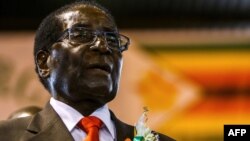 (FILES) In this file photo taken on April 07, 2016 then Zimbabwe's President Robert Mugabe attends a meeting with the Zimbabwe National Liberation War Veterans Association in Harare. A Zimbabwe parliament committee has summoned former president Robert Mugabe to give evidence on May 9, 2018 over diamond corruption costing billions of dollars, underlining his dramatic fall from power after 37 years of autocratic rule. / AFP PHOTO / Jekesai NJIKIZANA