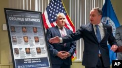 Matthew Albence, right, the acting director of U.S. Immigration and Customs Enforcement, speaks during a news conference, Jan. 17, 2020, in New York.