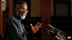 FILE - Imam Johari Abdul-Malik, director of outreach at the Dar Al Hijrah Islamic Center, speaks during a news conference in Falls Church, Va., , Nov. 9, 2009. 