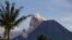 Mount Merapi releases volcanic materials down its slope during an eruption in Sleman, Indonesia, March 27, 2021. 
