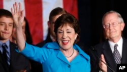 Incumbent U.S. Sen. Susan Collins, R-Maine, celebrates with husband Thomas Daffron, right, her re-election victory over Democrat Shenna Bellows, Nov. 4, 2014, in Portland, Maine. 