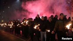 Members and supporters of several nationalist organizations take part in a march in commemoration of the late Gen. Hristo Lukov, a Bulgarian army commander, in Sofia, Bulgaria, Feb. 16, 2019. 