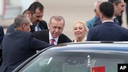 Turkey's President Recep Tayyip Erdogan boards his car after arriving at the Ministro Pistarini international airport to attend the G20 Summit in Buenos Aires, Argentina, Nov. 29, 2018.