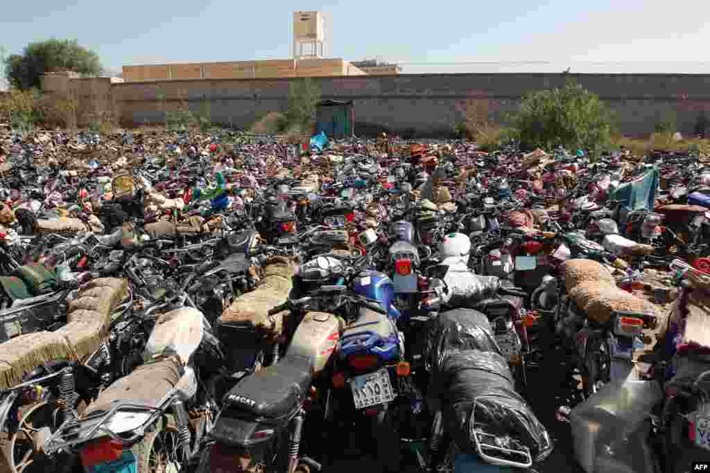 Motorcycles that were seized at the police headquaters in Sana&#39;a, Yemen, after their owners violated a 15-day ban on motorcycles. Yemen began enforcing a temporary ban on motorbikes in the capital to prevent &quot;shoot and scoot&quot; attacks as al-Qaida suspects on a motorbike elsewhere killed an army officer.
