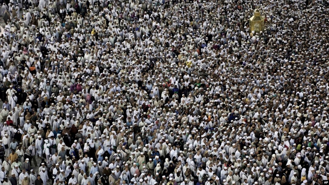Muslim pilgrims circle the Kaaba and try to touch Maqam Ibrahim or The Station of Abraham, the golden glass structure top right, at the Grand Mosque in the Muslim holy city of Mecca, Saudi Arabia, Wednesday, Sept. 7, 2016. 