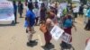 Some Zimbabweans camped outside the US Embassy in Harare this week (Oct. 25, 2021) calling for removal of sanction on the country's leadership. (Columbus Mavhunga/VOA)