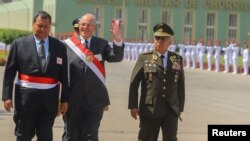 Peruvian President Pedro Pablo Kuczynski attends a ceremony at the air force base in Lima, Peru, Dec. 14, 2017. In a speech at the ceremony, he did not directly address the Odebrecht disclosure about a transfer of $4.8 million to companies linked to him. 