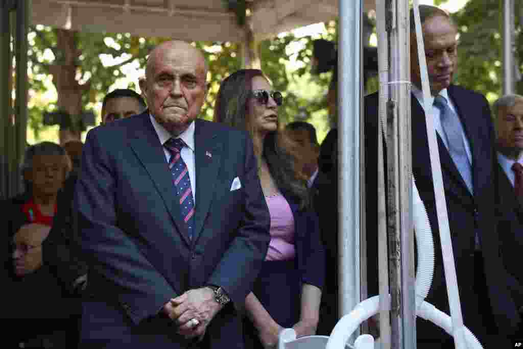 Former New York City Mayor Rudy Giuliani, left, and former New York Gov. George Pataki, right, attend the 9/11 memorial ceremony on the 23rd anniversary of terror attacks, in New York, Sept. 11, 2024.