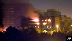 FILE - The Iraqi Ministry of Planning burns after being hit by a missile in Baghdad in March 20, 2003. U.S. forces launched their long-awaited war against Saddam Hussein, targeting him personally with a barrage of cruise missiles and bombs as a prelude to invasion.
