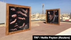 Photographs by street children displayed at the "Look at me" exhibition, Dakar, Senegal, May 11, 2018.