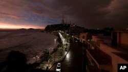 The sun sets, as Hurricane Willa makes landfall, in Mazatlan, Mexico, Oct. 23, 2018. Emergency officials said they evacuated more than 4,250 people in coastal towns and set up 58 shelters ahead of the dangerous Category 3 storm.